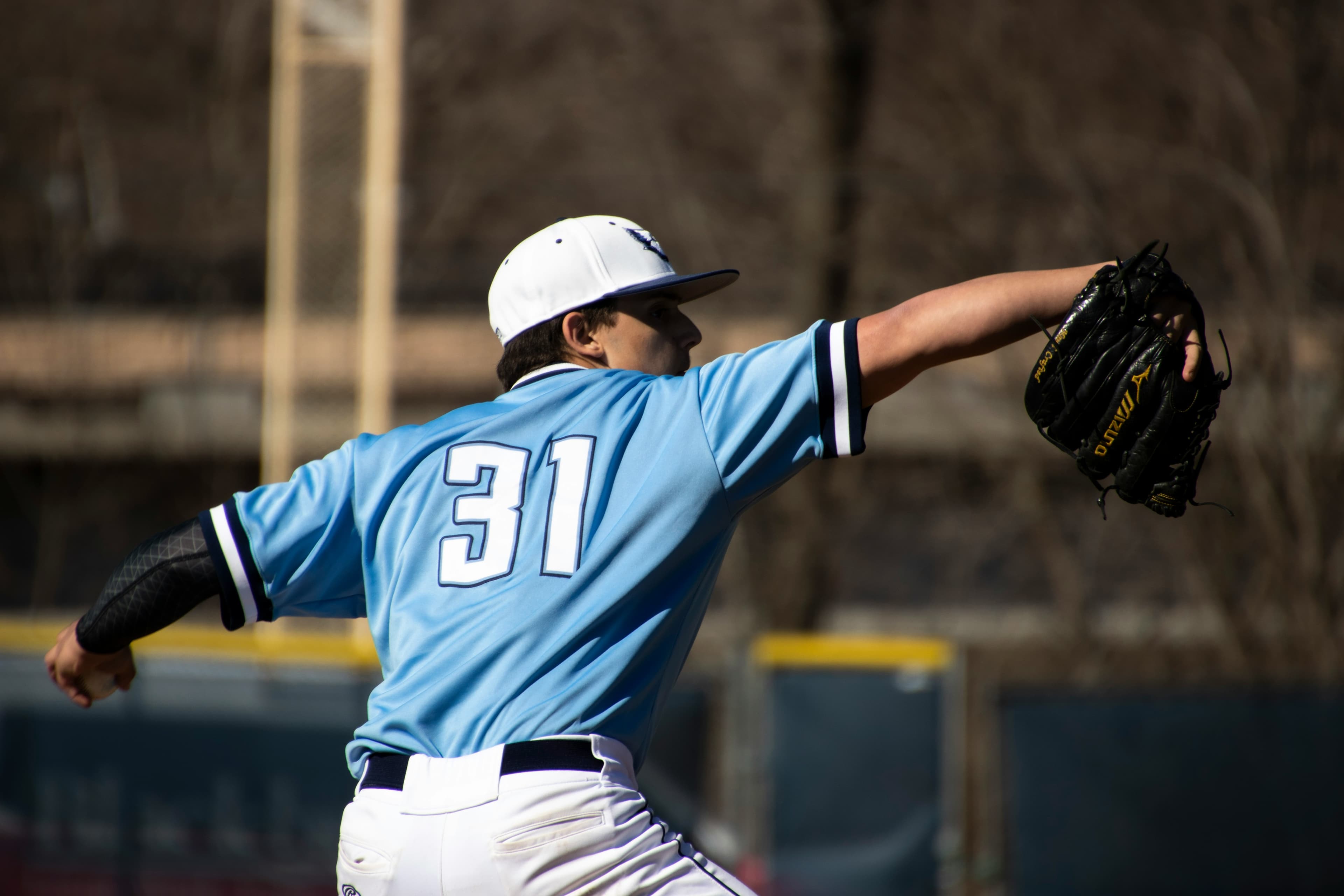 NJCAA Baseball Player NJCAA baseball player in blue uniform at bat during a junior college game