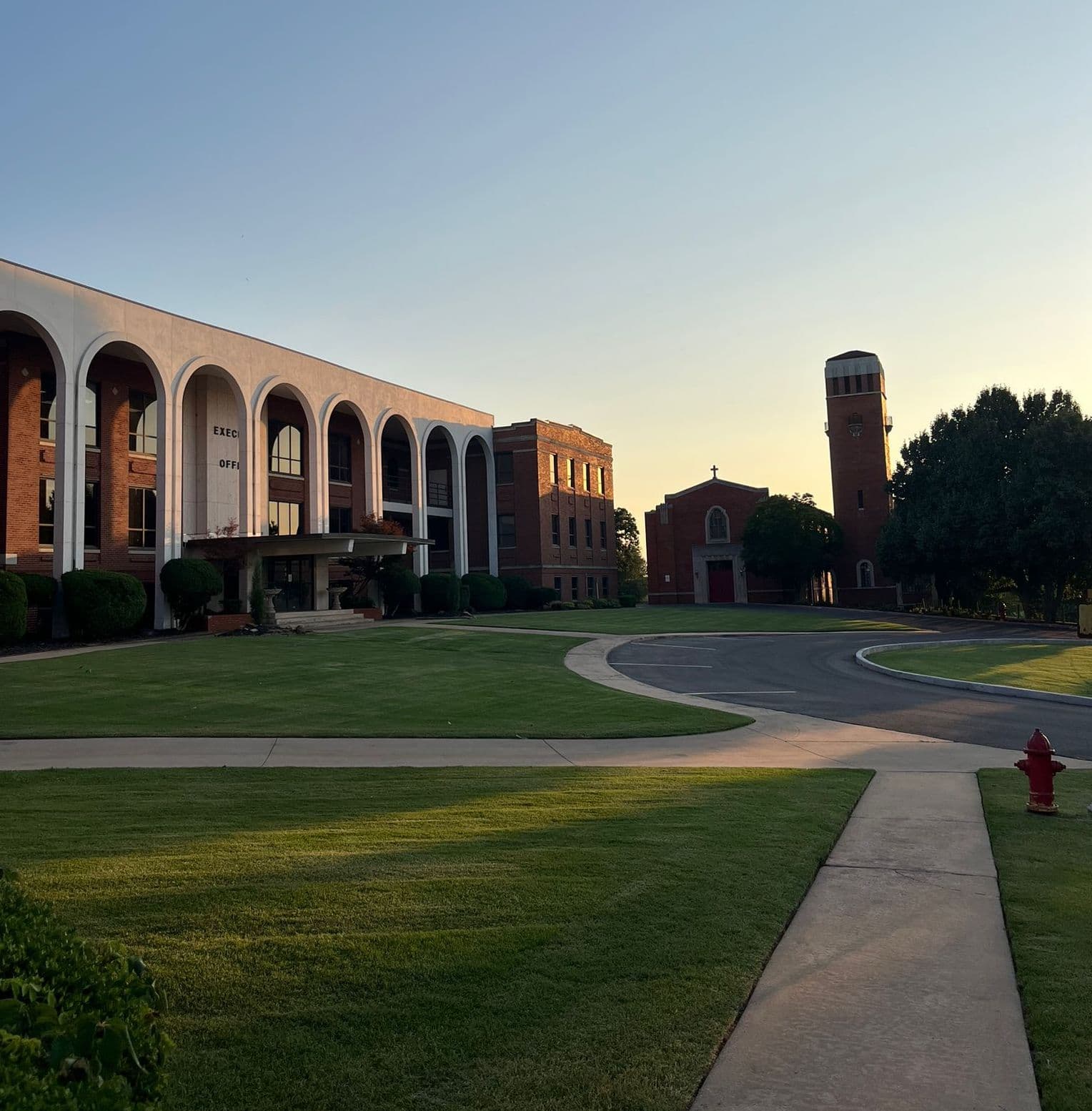 NAIA College Campus NAIA university campus with modern architecture, green lawn, and elegant columns