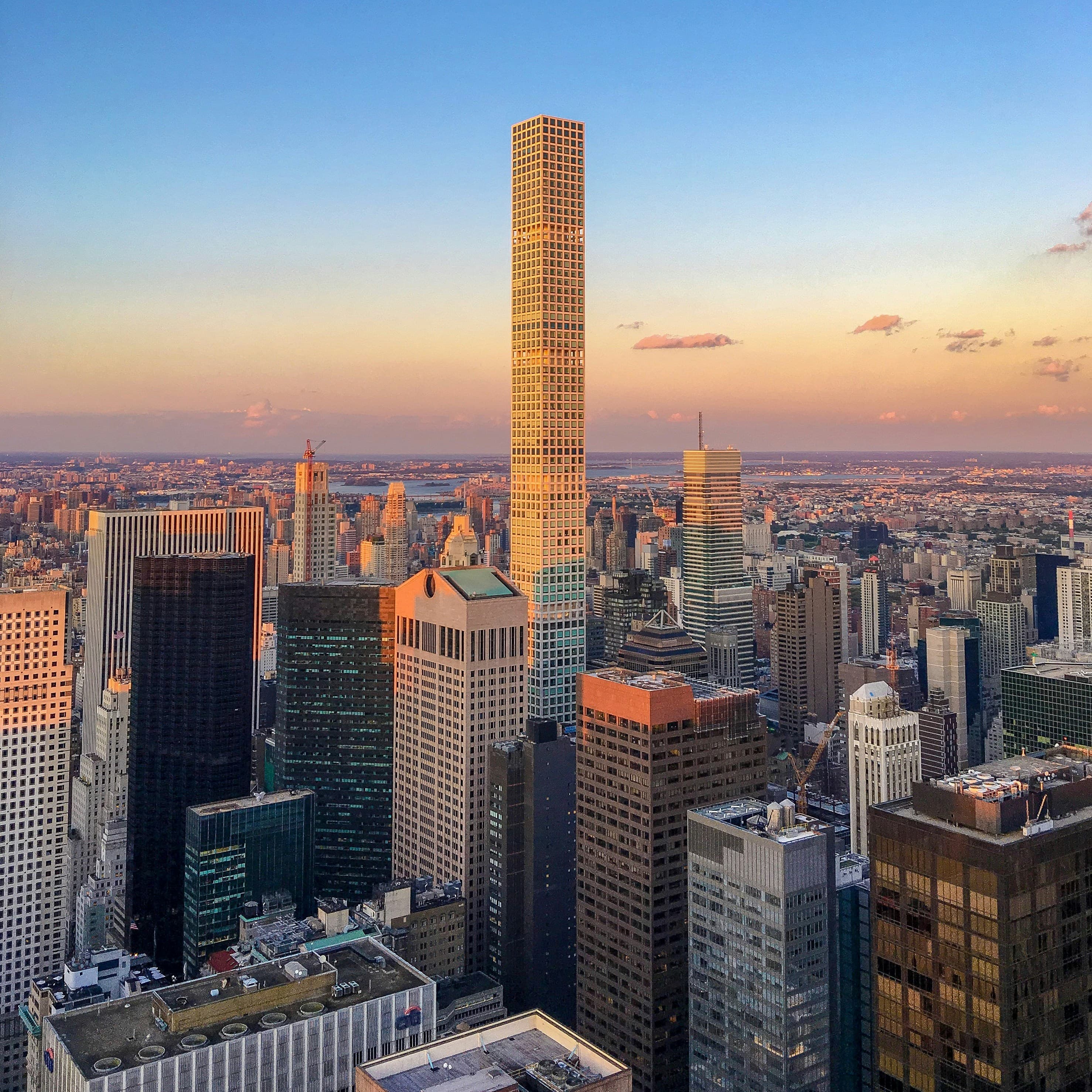 Modern city skyline with tall buildings and urban architecture at sunset