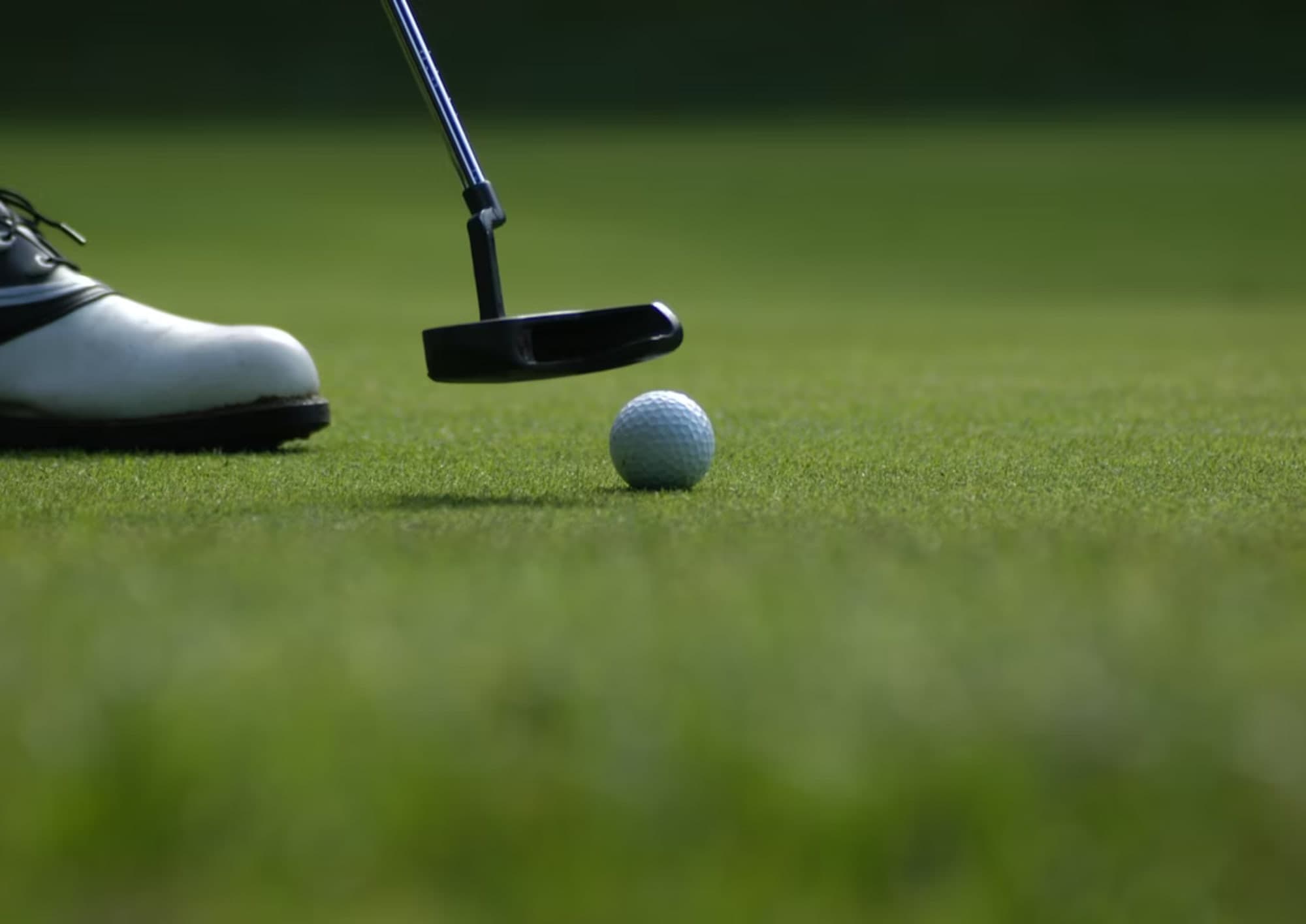 Arthur Akpinar playing college golf at the University of Denver