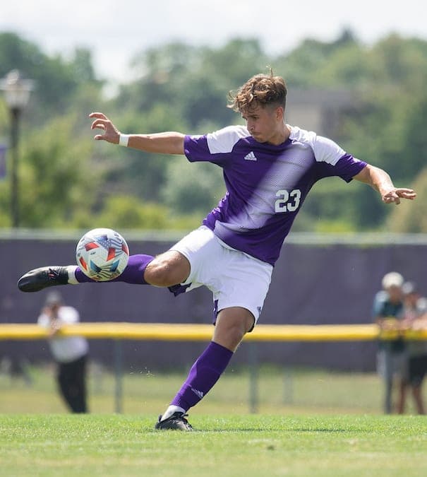 Benedikt Zechmeister – College Soccer Player | Smarthlete College soccer player Benedikt Zechmeister striking a soccer ball on a soccer field.