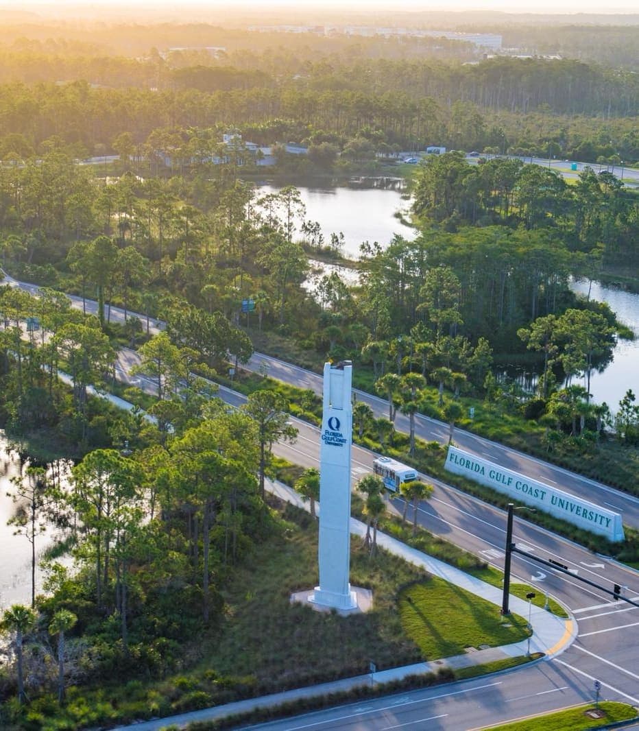 Aerial View of Florida Gulf Coast University Campus Aerial view of Florida Gulf Coast University with bodies of water and trees.