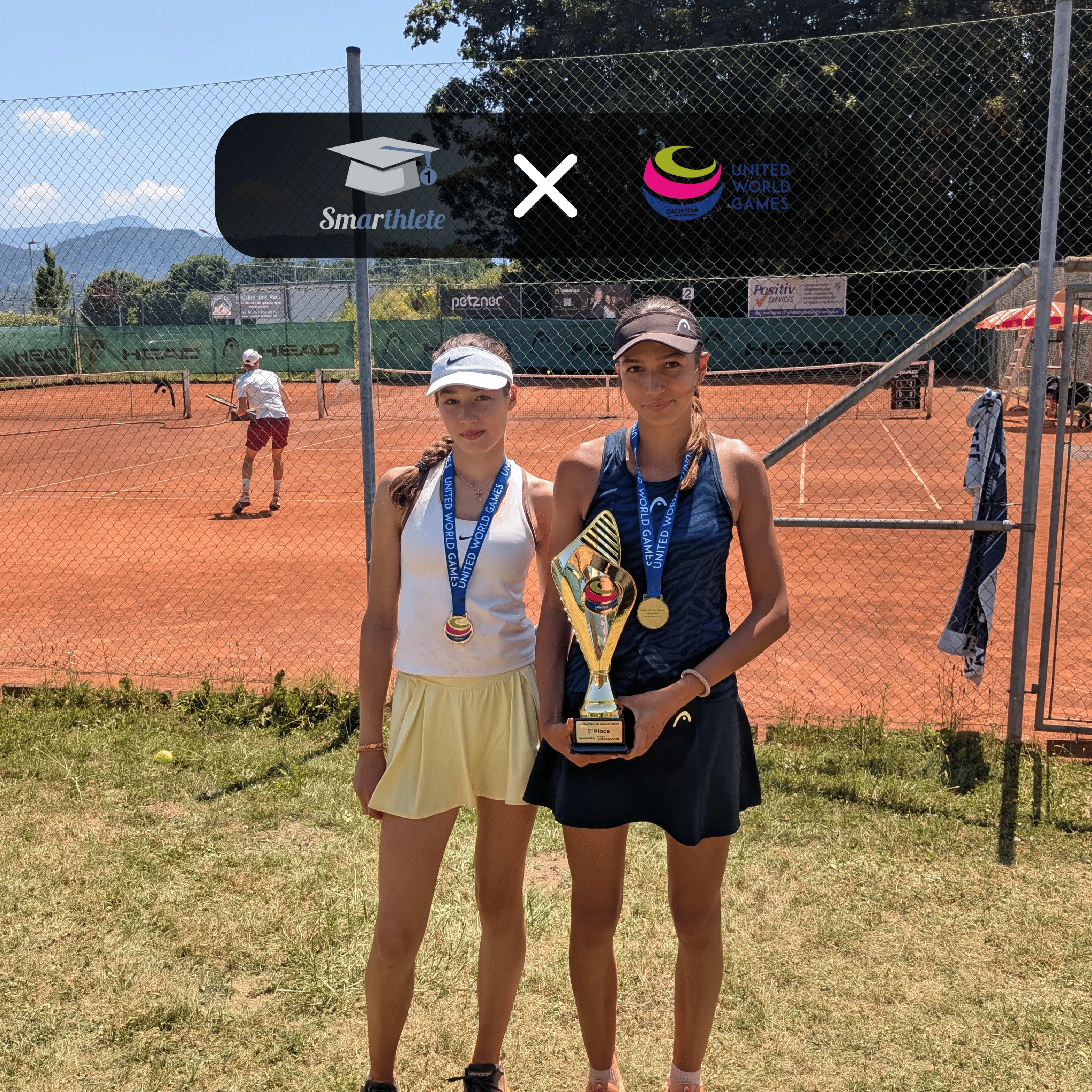 Smarthlete Tennis Showcase Trophy at the United World Games Two young female tennis players presenting their trophy at the Smarthlete Tennis Showcase at the United World Games.