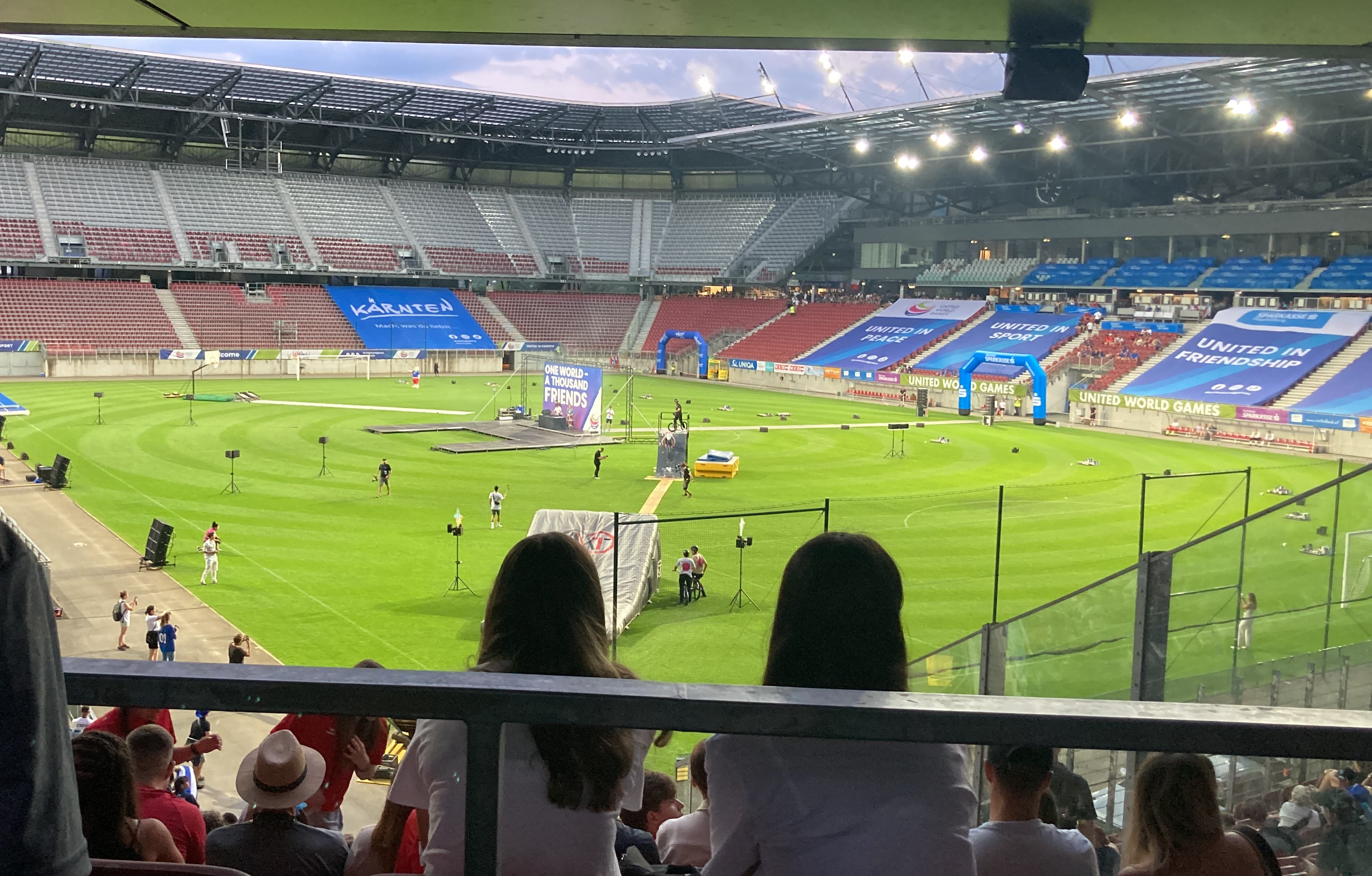 Wörthersee Stadium at the United World Games View from the stands of the Wörthersee Stadium in Klagenfurt during the United World Games, featuring a large soccer field with event banners.