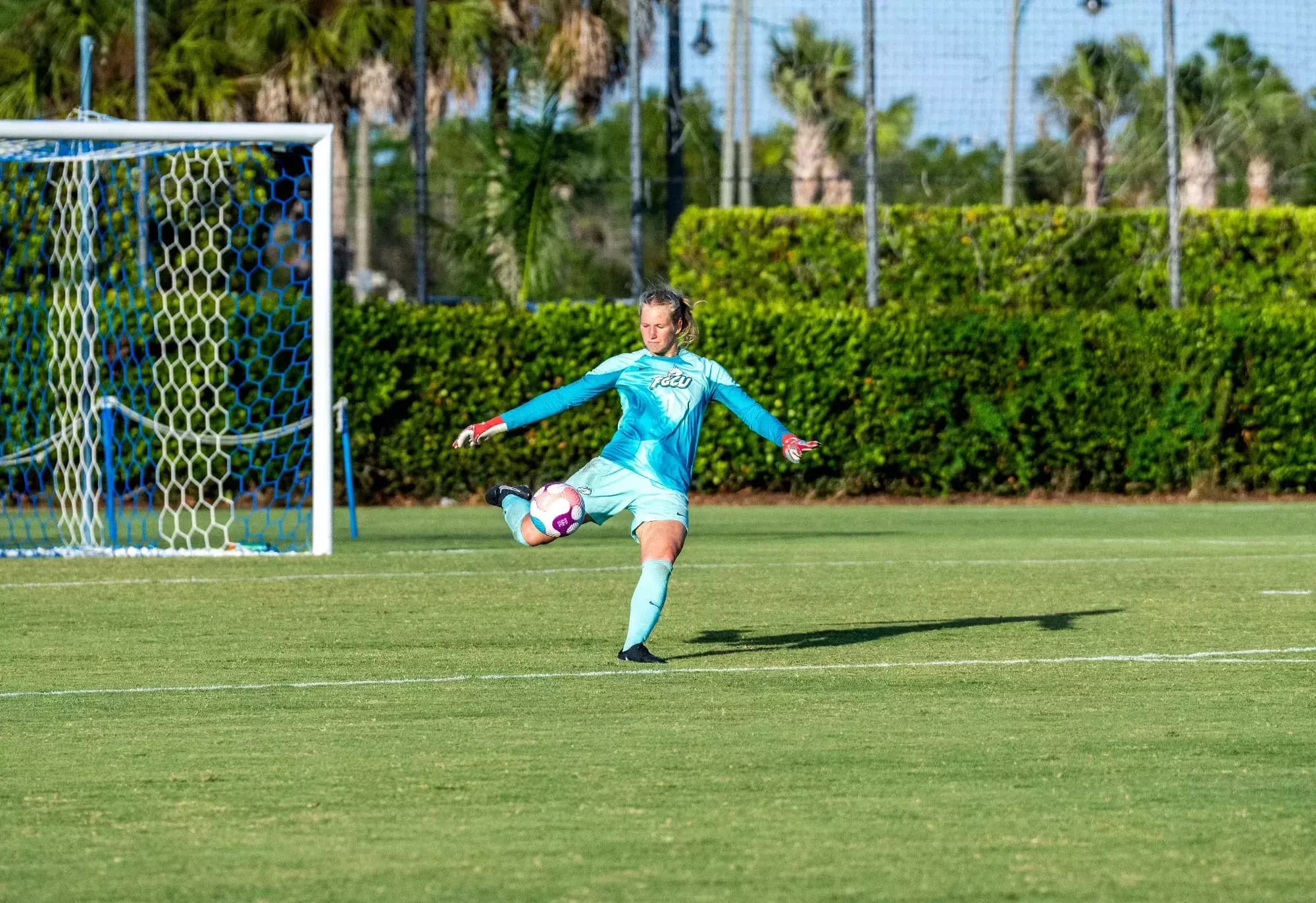 Madara Matrevica as Goalkeeper at Florida Gulf Coast University Florida Gulf Coast University's soccer goalkeeper Madara Matrevica about to kick the ball in the air.